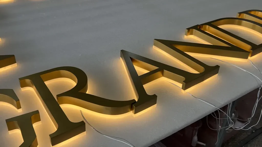 Metal letter bodies being fabricated for custom halo-lit signage